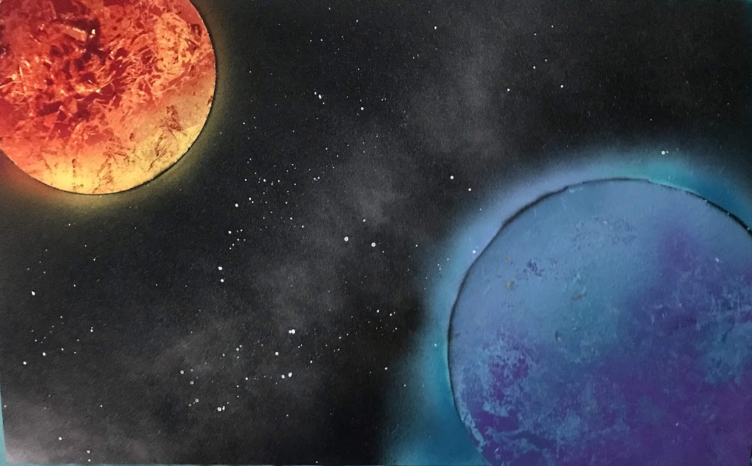 Two spray painted planets